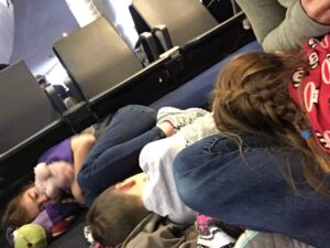 Kids sleeping in airport